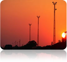 communications towers sunset